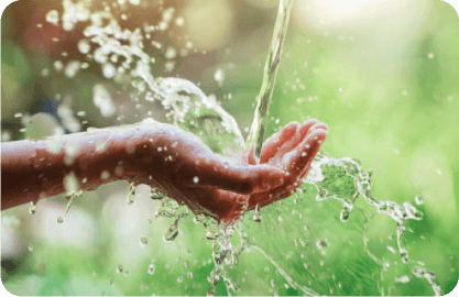 A hand cupped catching water